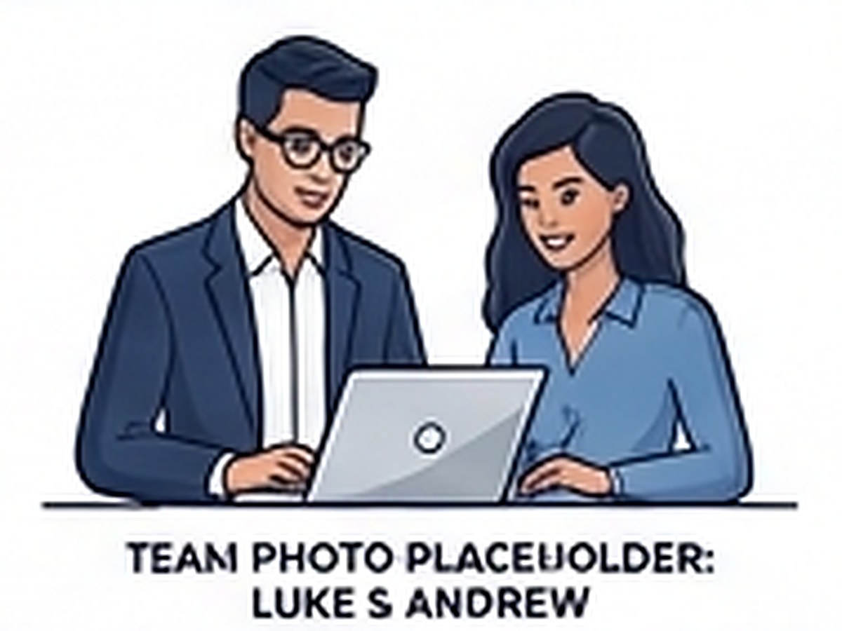 Luke and Andrew working together at a laptop
